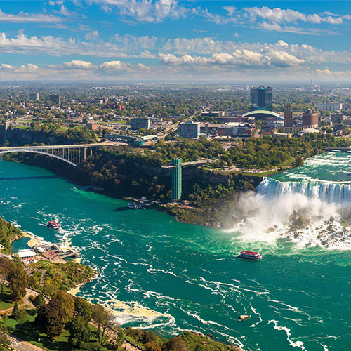 Aerial view of Niagara Falls, Canada, showcasing the majestic waterfalls and the Rainbow Bridge